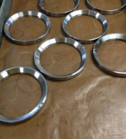 Metal rings, a quantity of six, fabricated by SC Industries in Houston.