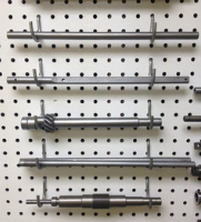 Arrangement of machined metal components, fabricated by SC Industries in Houston.